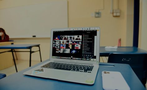macbook pro on blue table